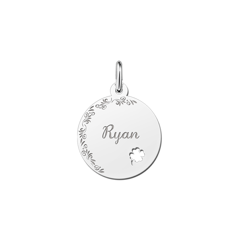 Silver pendant with floral edge and four-leaf clover