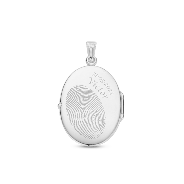 Silver oval medallion with engraving