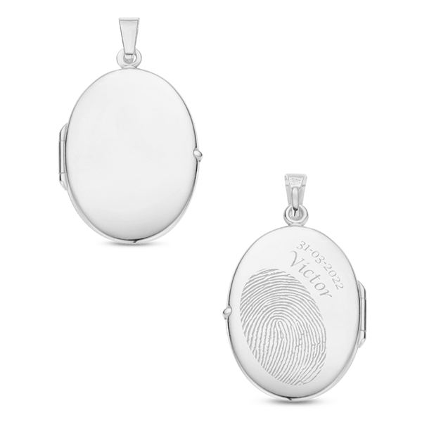 Silver oval medallion with engraving