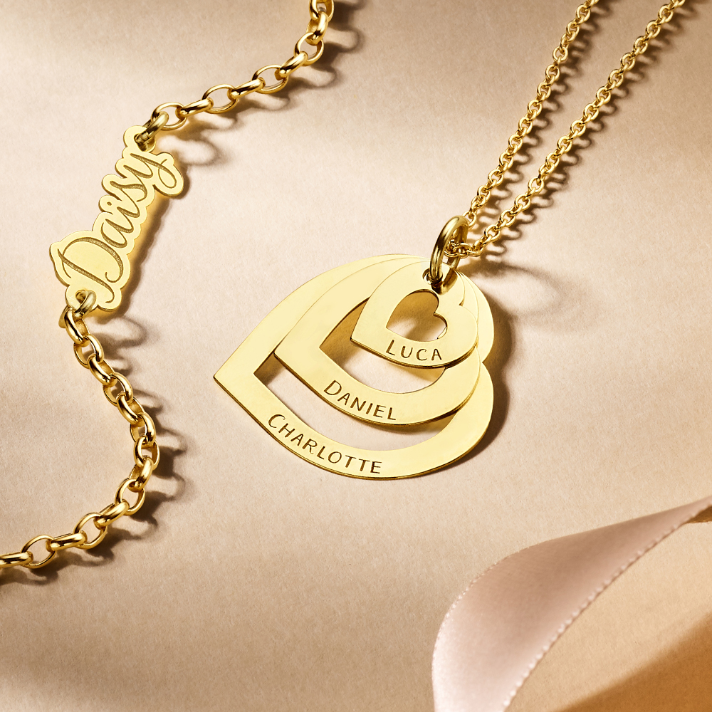 Gold family necklace with three separate hearts