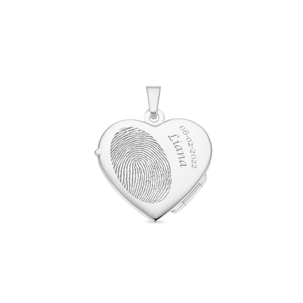 Silver heart medallion with flower engraving