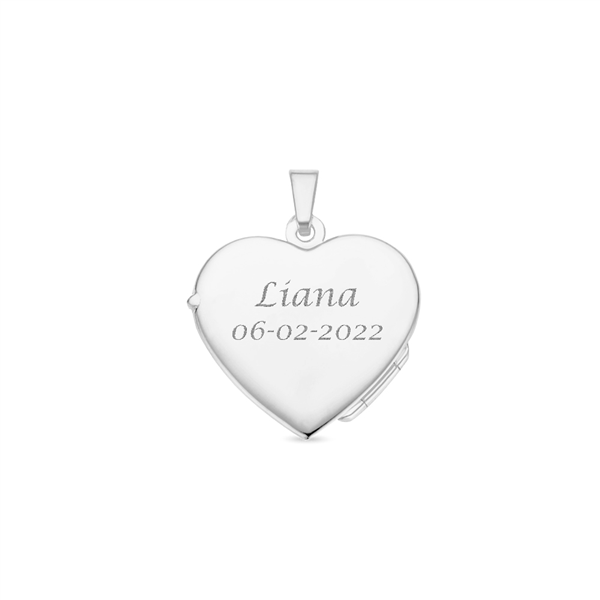 Silver heart medallion with flower engraving