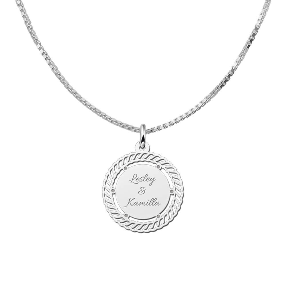 Vintage pendant with decorative edge and engraving in silver