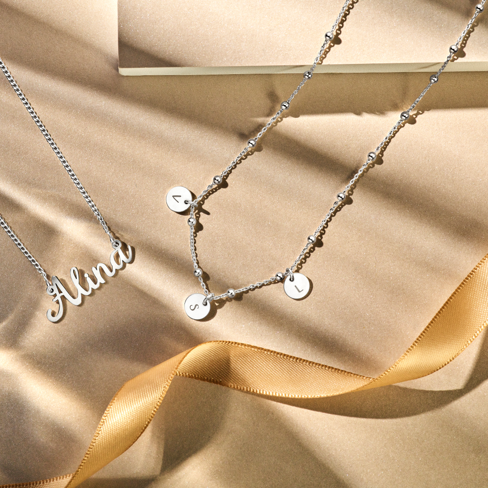 Silver minimalist round pendants with tree initials