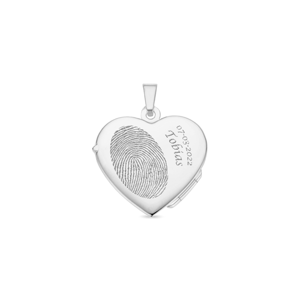 Silver heart medallion with engraving