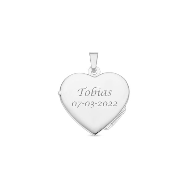 Silver heart medallion with engraving