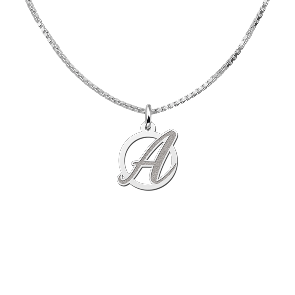 Curved letter pendant of silver