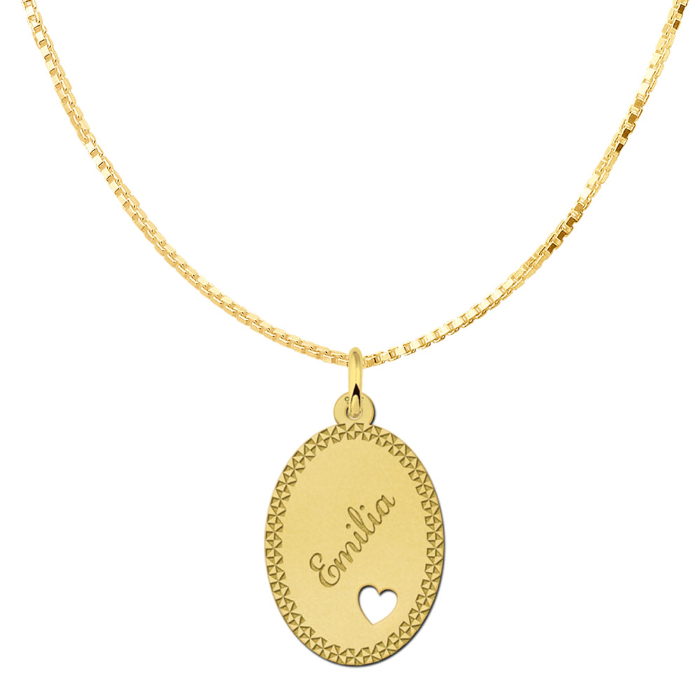 Gold-plated oval pendant with decorative border and heart