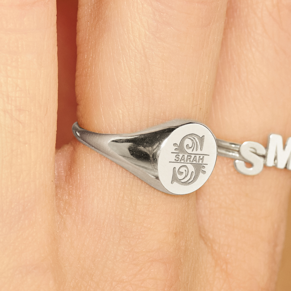 Round silver signet ring with an initial and name