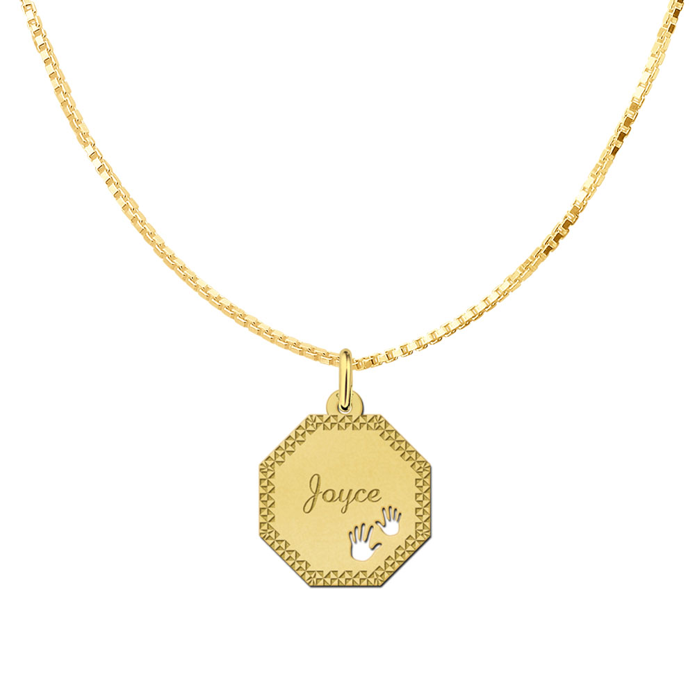 Gold-plated octagonal pendant with decorative border and baby hands