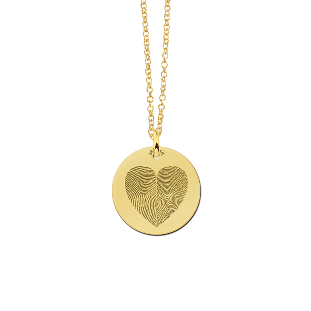 Golden pendant with two fingerprints in heart shape