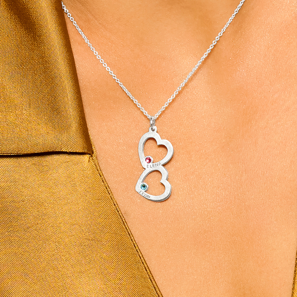 Silver pendant with two hearts