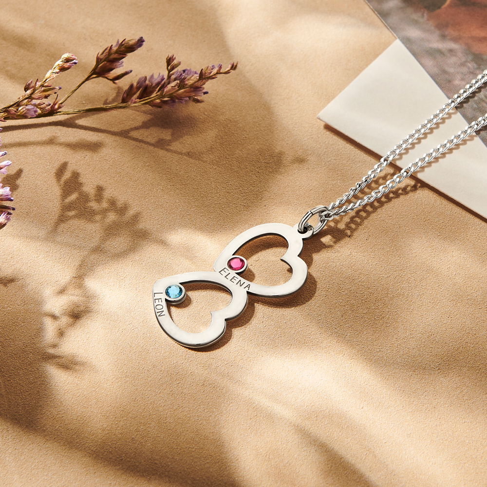 Silver pendant with two hearts