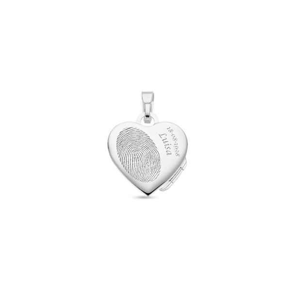 Silver heart medallion with a decorated rim