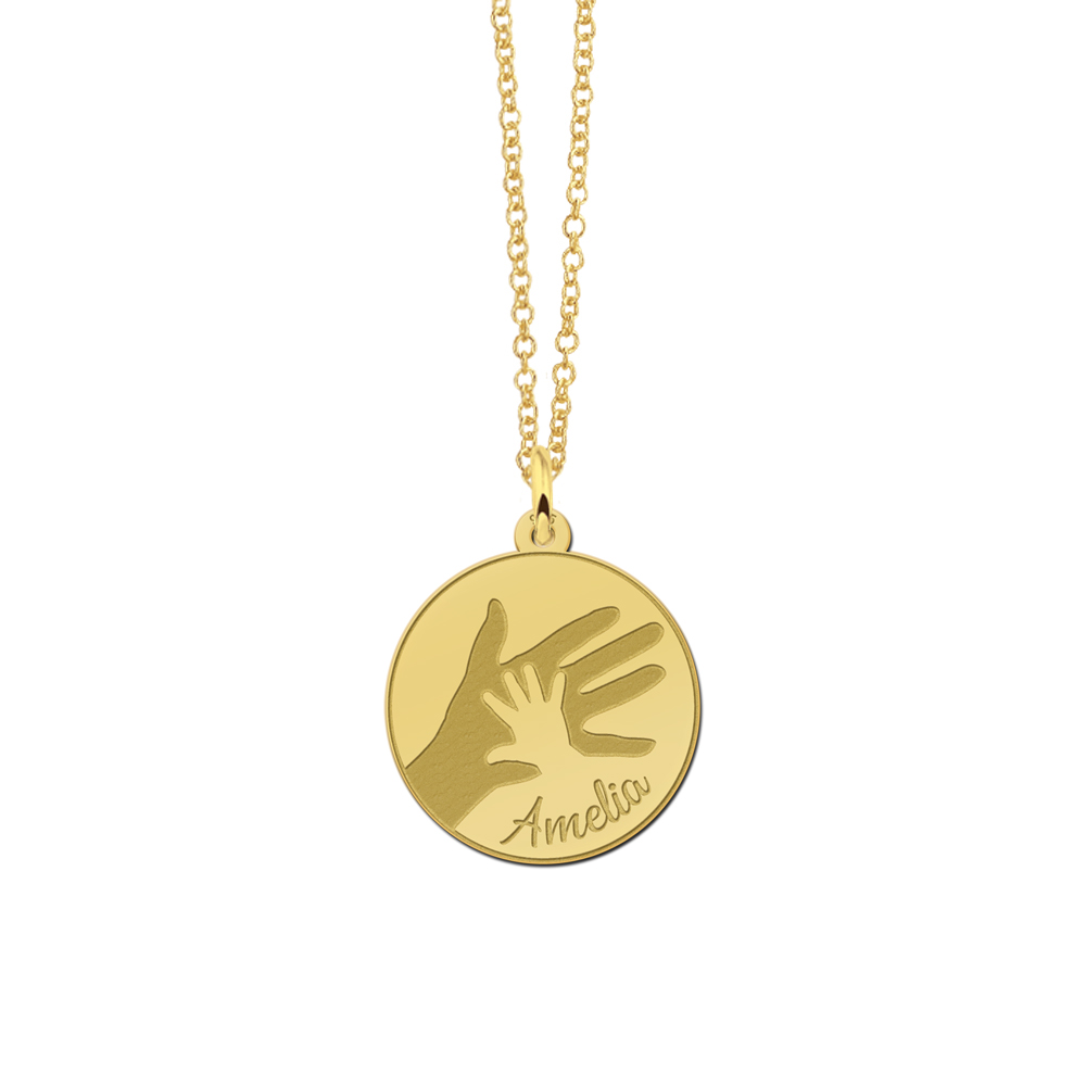 Gold plated round pendant with large and small handprint