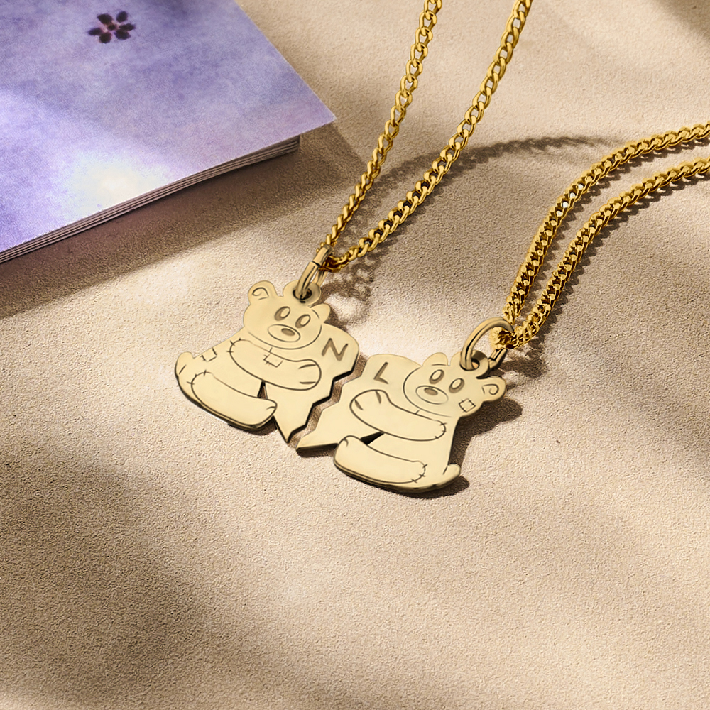 Golden interlocking pendant with bears