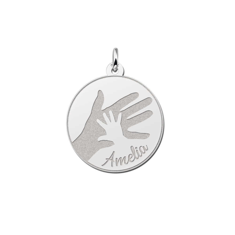 Silver round pendant with big and small handprint