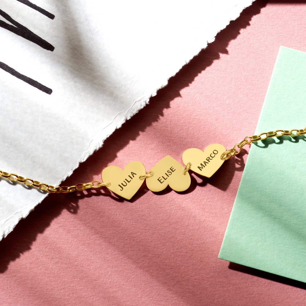 Gold name bracelet with 3 hearts