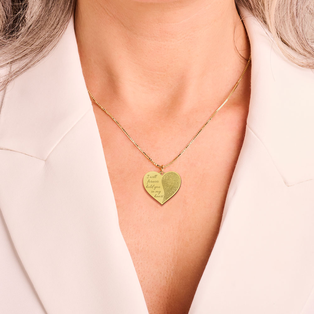 Golden fingerprint jewellery in heart shape