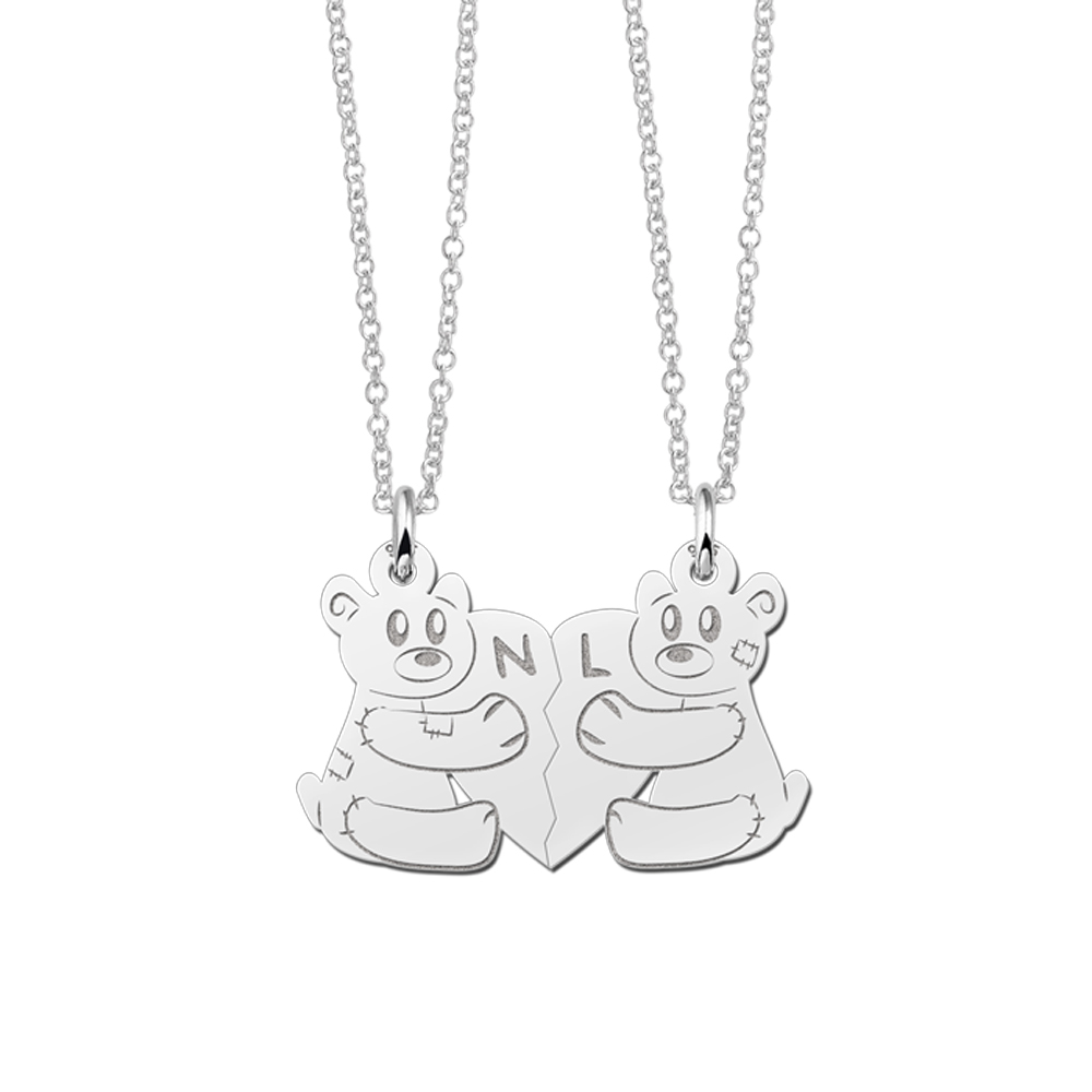 Silver interlocking pendant with bears