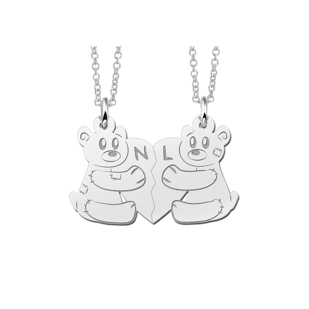 Silver interlocking pendant with bears