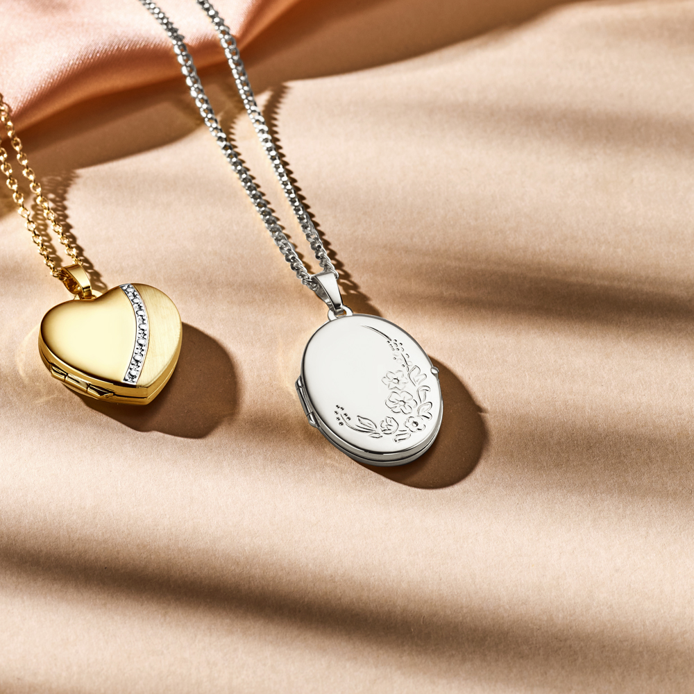 Silver medallion oval with flowers engraving