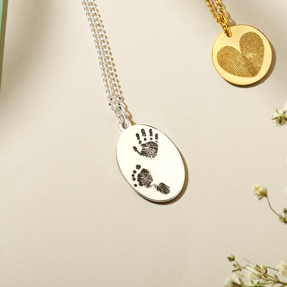 Silver oval pendant with full fingerprint