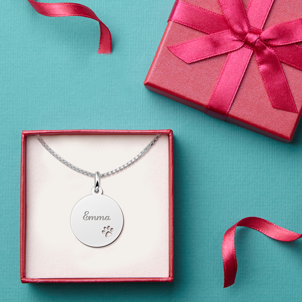 Silver pendant with name and cut-out paw print