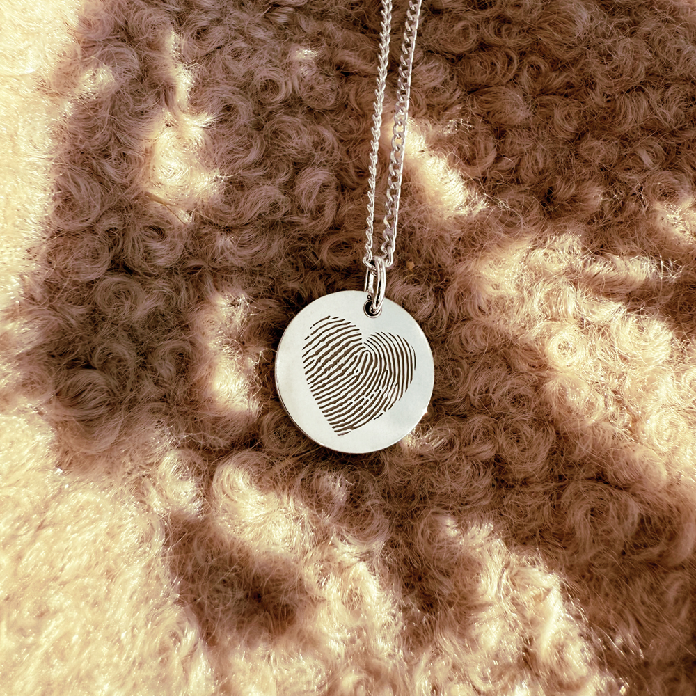 Sterling silver round pendant with heart-shaped fingerprint