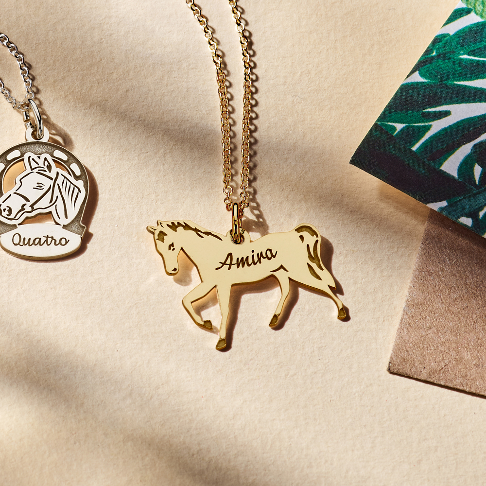 Gold animal jewelry with a horse and engraving