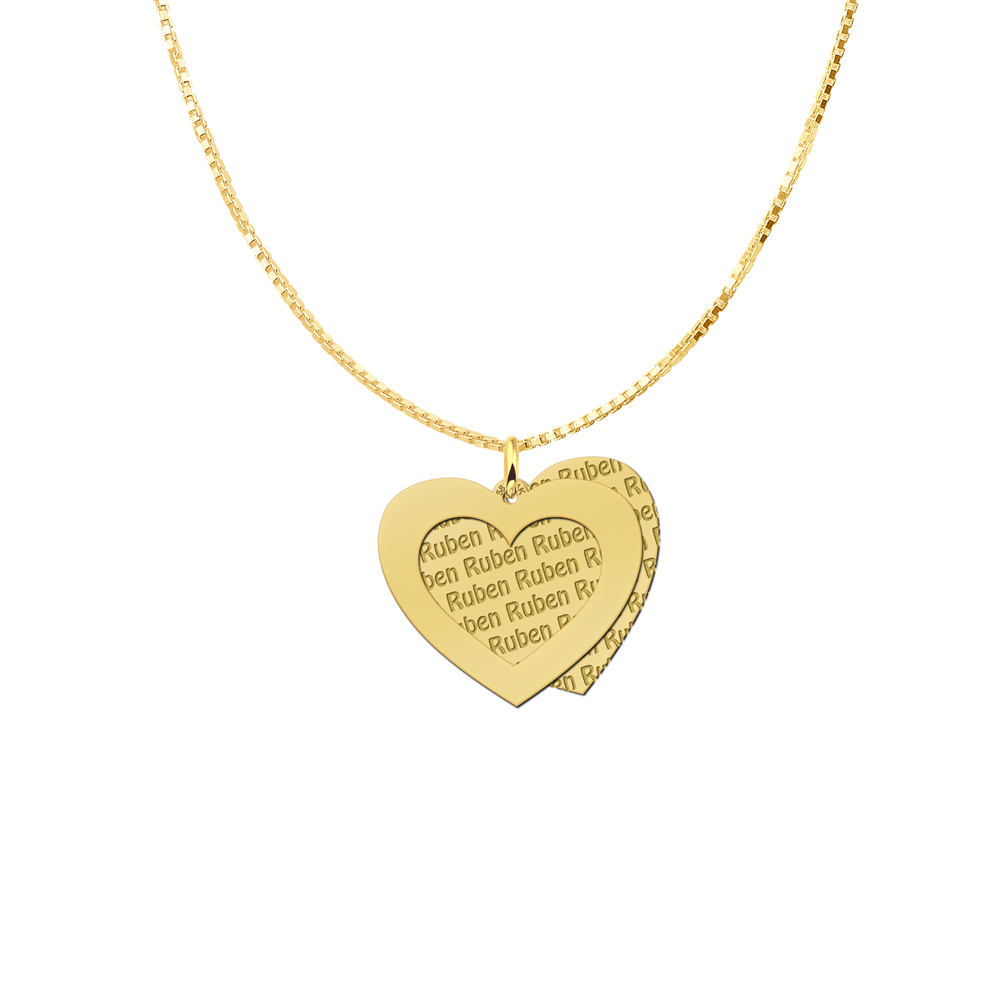 Gold heart-shaped pendant with cut-out heart and engraved name