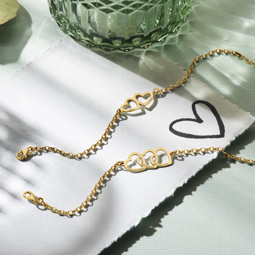 Gold bracelet with three linked hearts and names