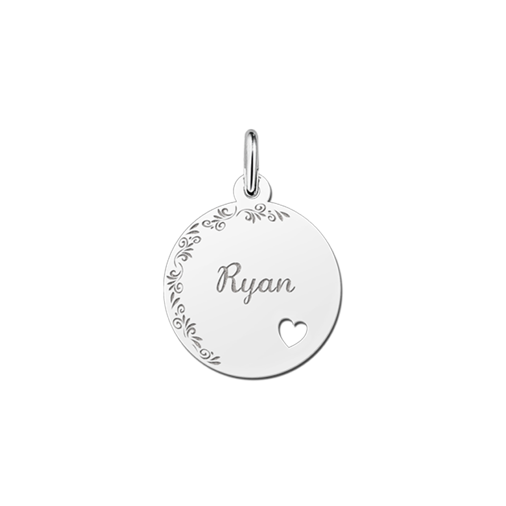 Silver pendant with floral edge and heart