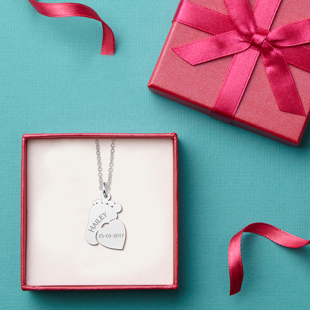 Silver mom necklace with baby feet and little heart