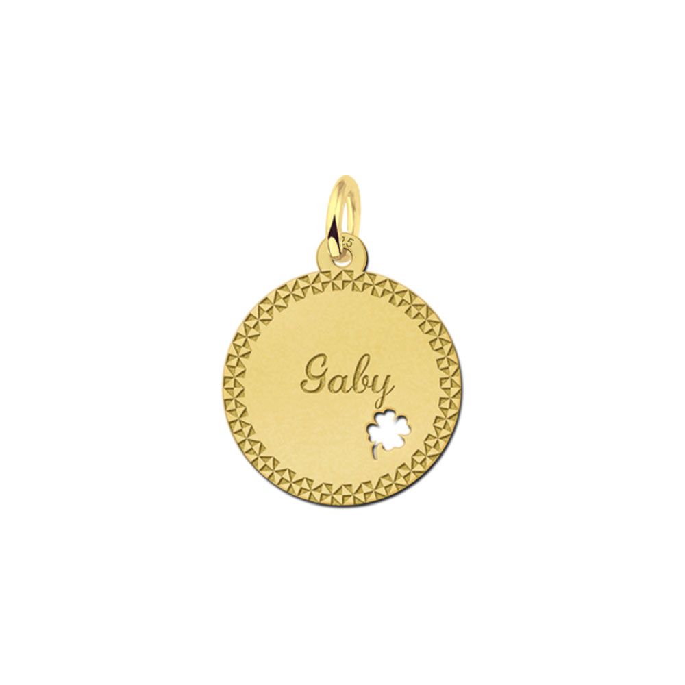 Gold-plated pendant with decorative border and four-leaf clover