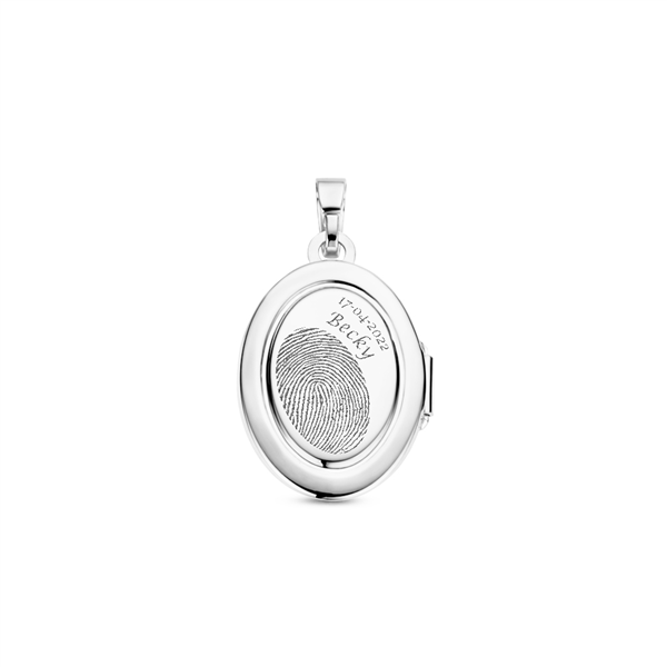 Silver oval medallion with decorative line