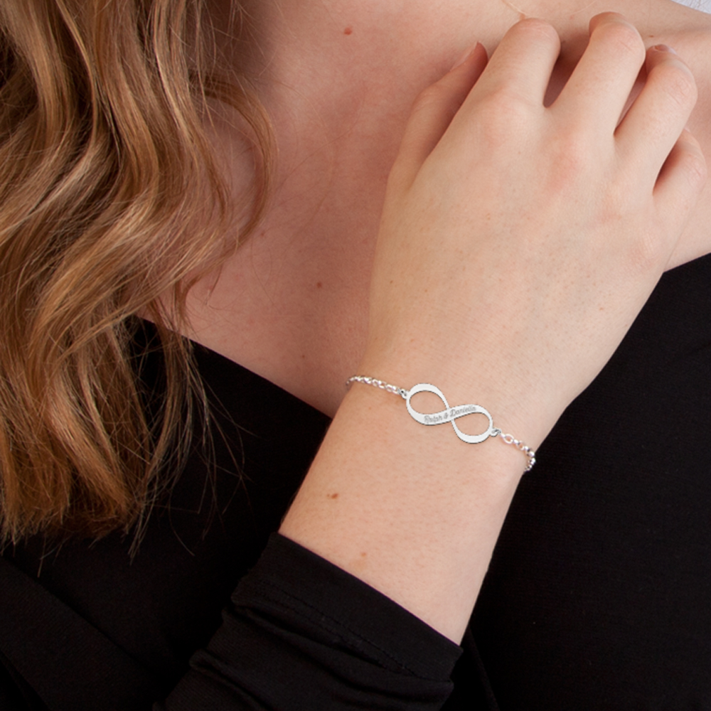 Silver infinity bracelet with two engraved names