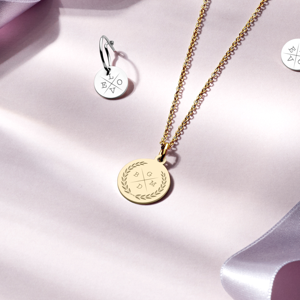 Letter necklace of gold with four initials