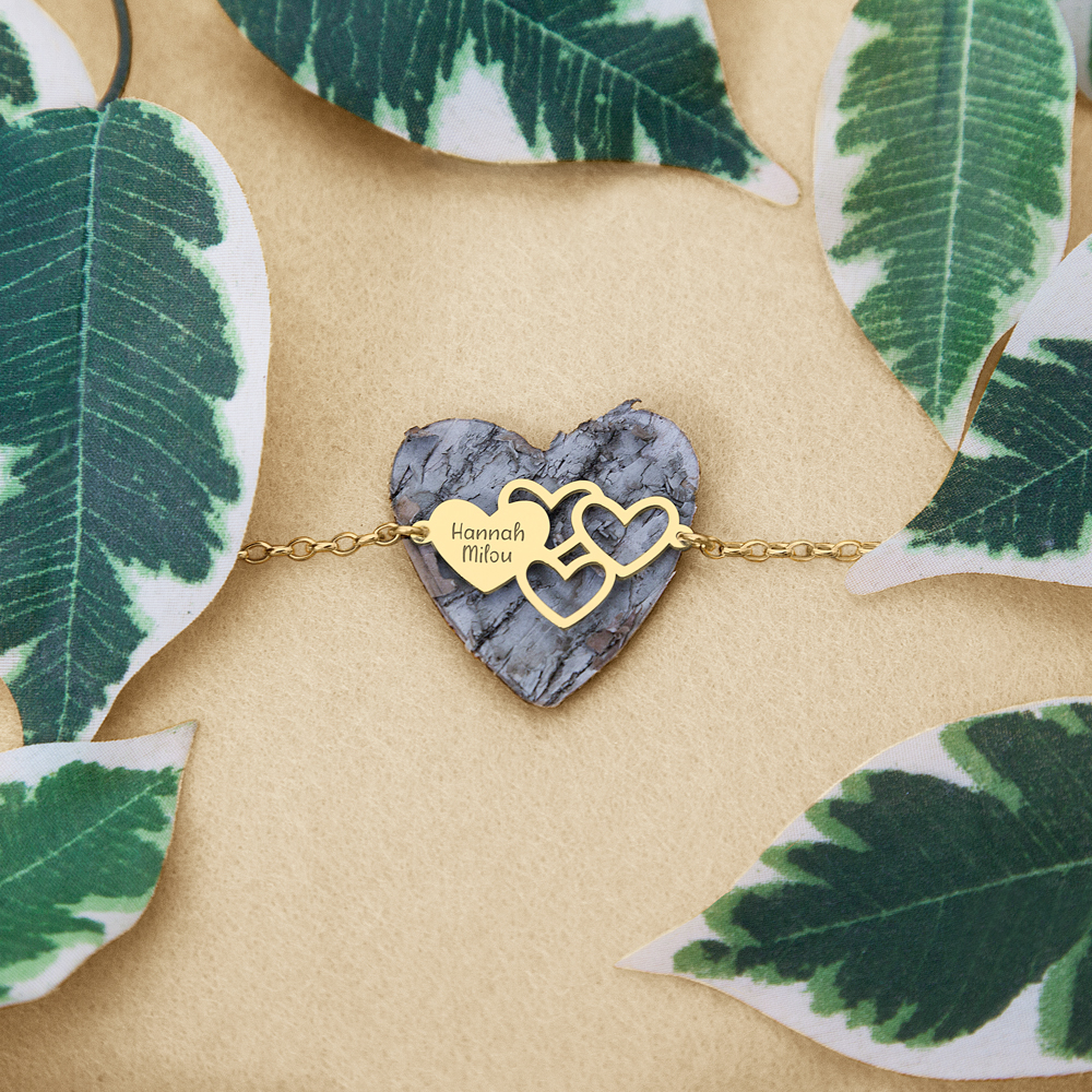 Golden bracelet with names and hearts