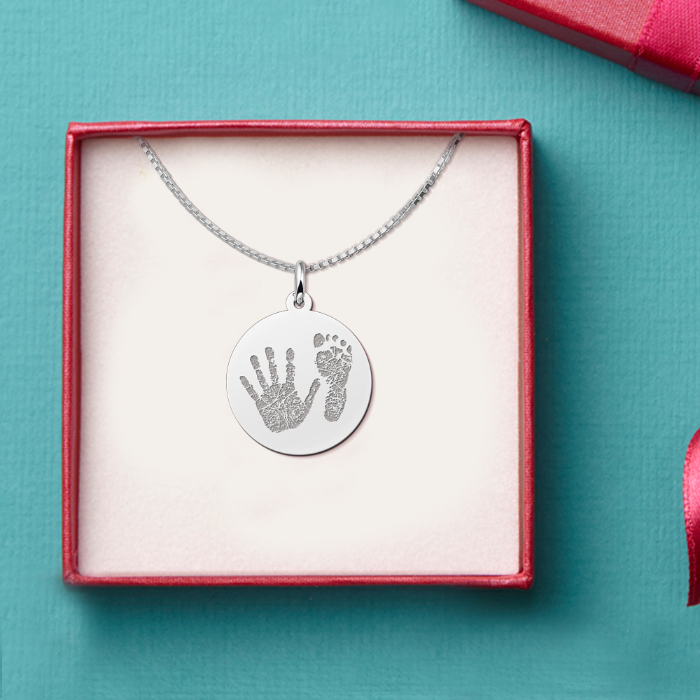 Silver round handprint pendant