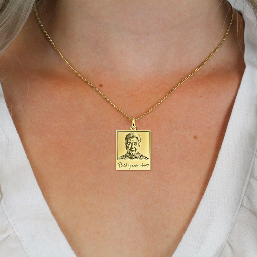 Golden polaroid photo-pendant with own handwriting