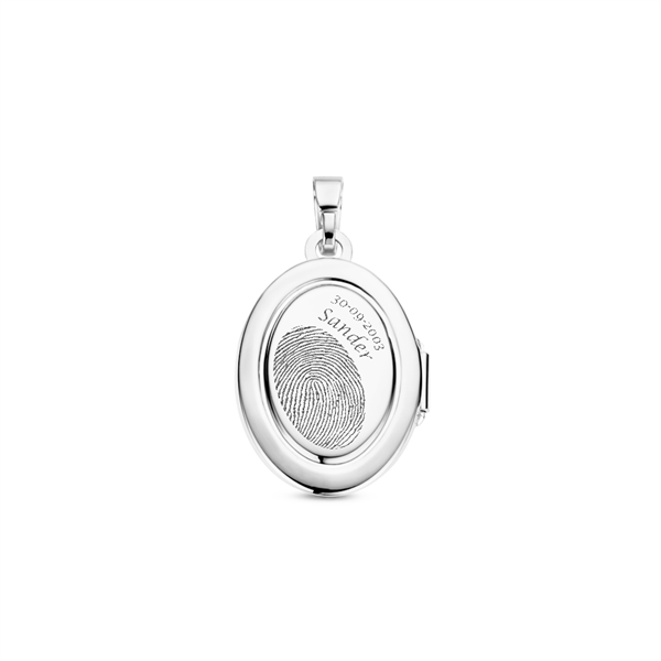 Silver oval medallion with ornament