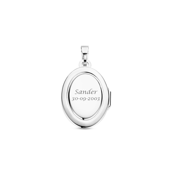 Silver oval medallion with ornament