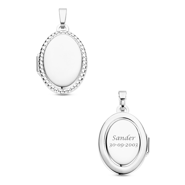 Silver oval medallion with ornament