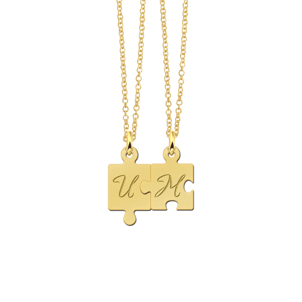 Gold plated puzzle piece pendants with initials
