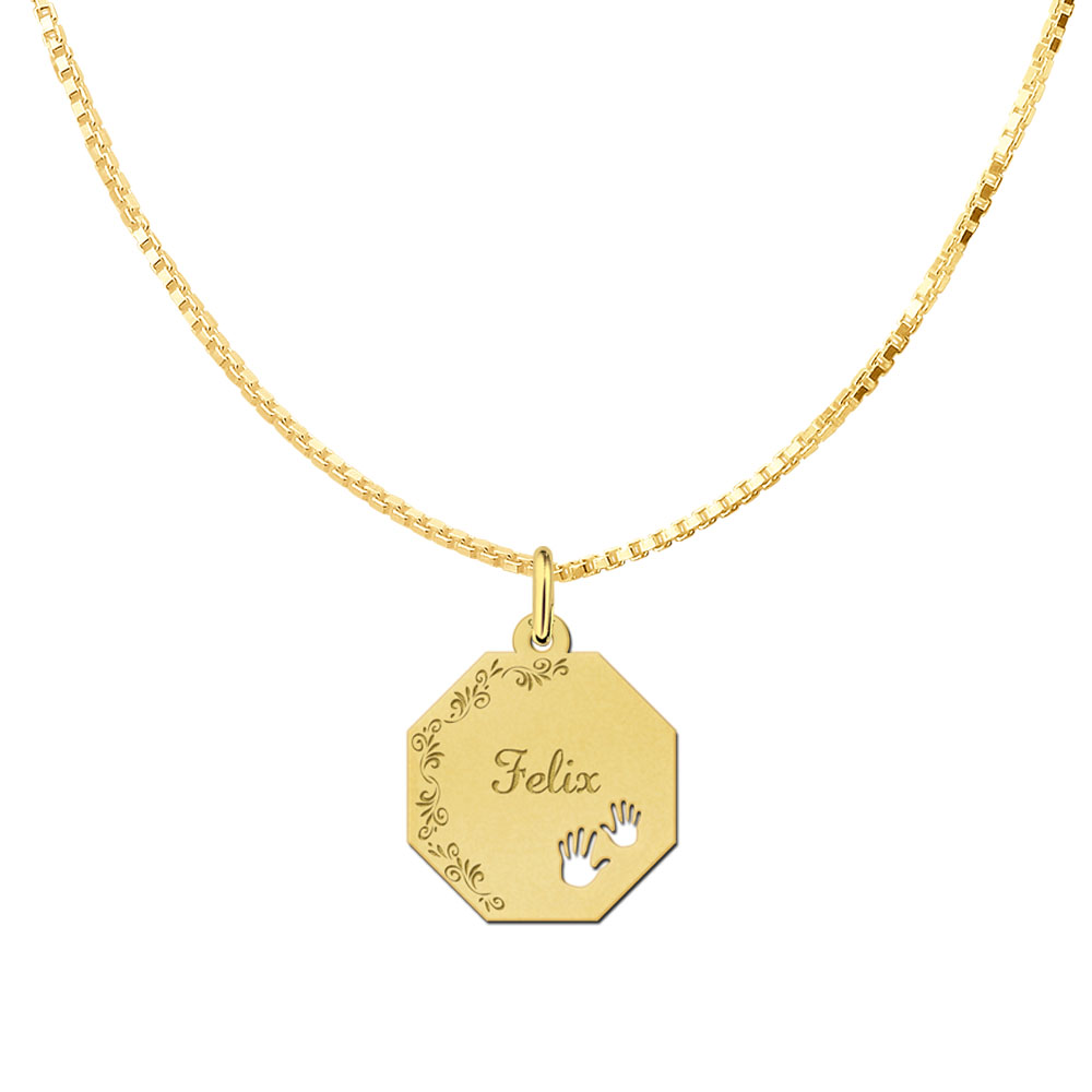 Gold-plated octagonal pendant with floral border and baby hands